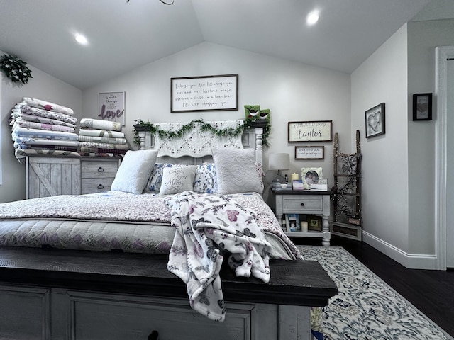 bedroom featuring vaulted ceiling and dark hardwood / wood-style flooring