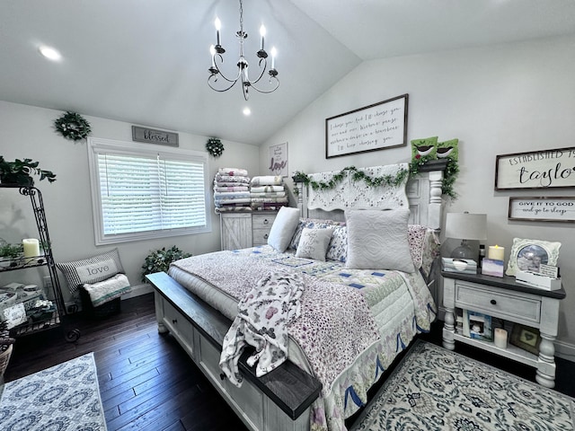 bedroom featuring lofted ceiling, dark hardwood / wood-style floors, and an inviting chandelier