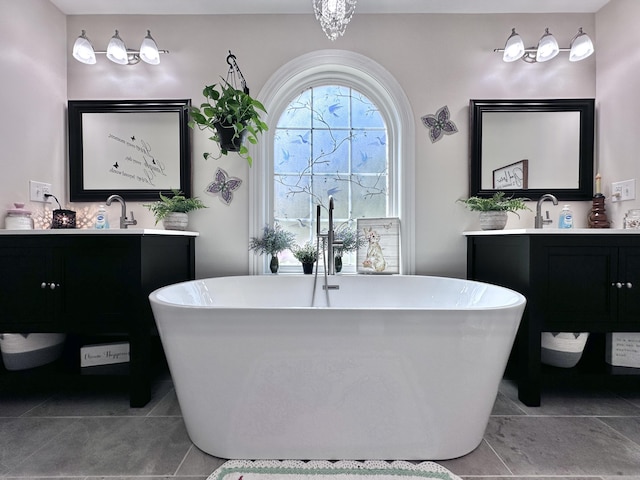 bathroom with a washtub and vanity