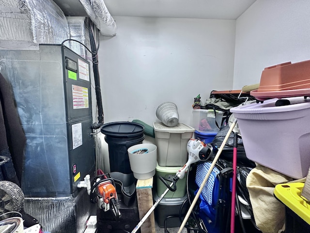 utility room featuring heating unit