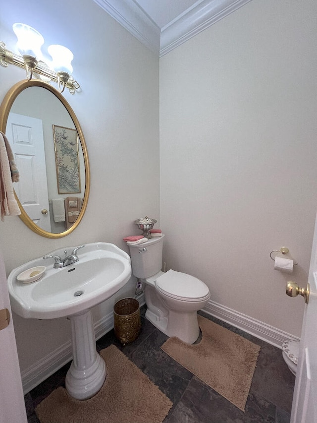 bathroom with crown molding, sink, toilet, and tile floors