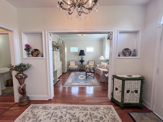 entryway featuring dark wood-type flooring and a chandelier