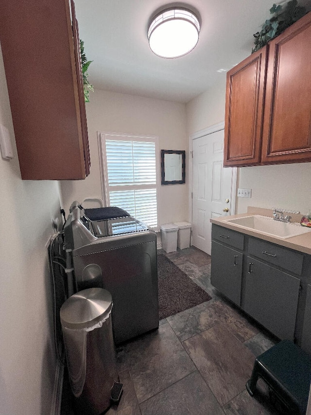 interior space with dark tile flooring and sink