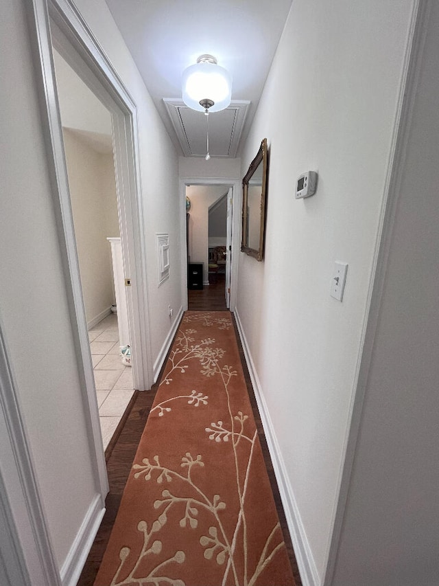 hallway featuring tile flooring