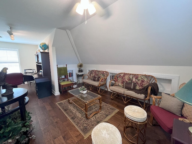 living room with dark hardwood / wood-style floors, ceiling fan, and lofted ceiling