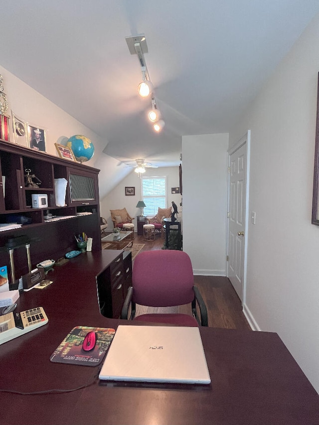 office area featuring dark hardwood / wood-style floors, ceiling fan, track lighting, and lofted ceiling