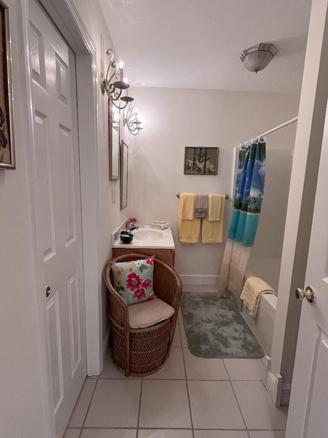 bathroom featuring tile flooring and vanity