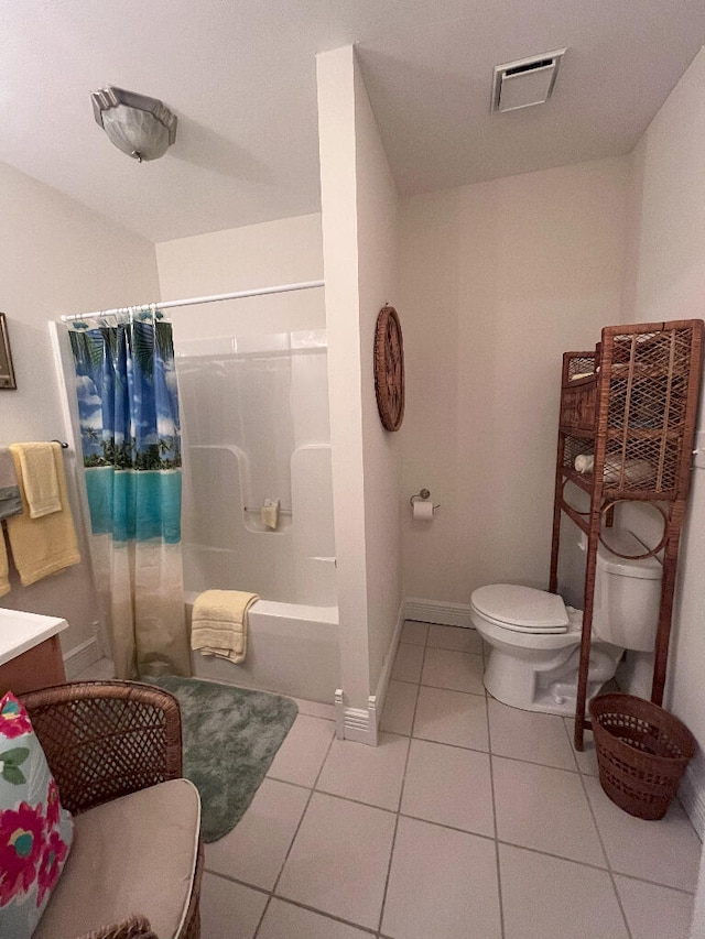 full bathroom featuring tile floors, vanity, toilet, and shower / bath combo with shower curtain