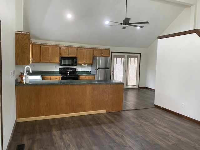 kitchen with sink, dark wood-type flooring, black appliances, and kitchen peninsula