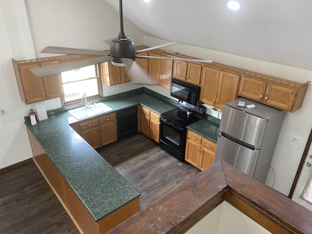 kitchen with lofted ceiling, sink, black appliances, and kitchen peninsula