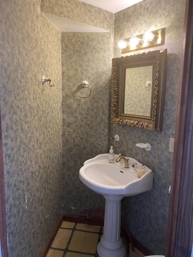 bathroom featuring tile patterned flooring and sink