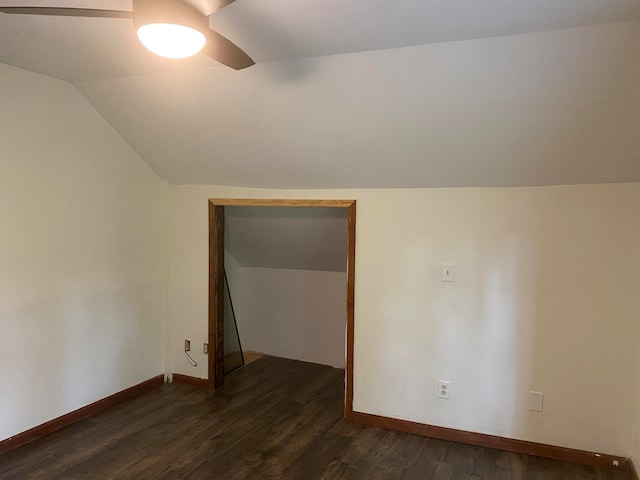 additional living space featuring lofted ceiling, dark hardwood / wood-style floors, and ceiling fan