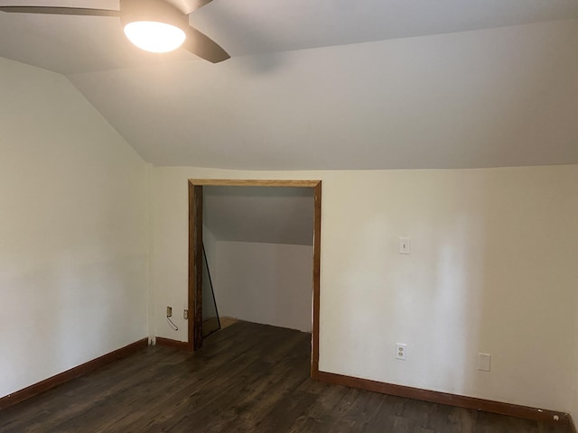 bonus room featuring baseboards, a ceiling fan, lofted ceiling, and dark wood-style flooring