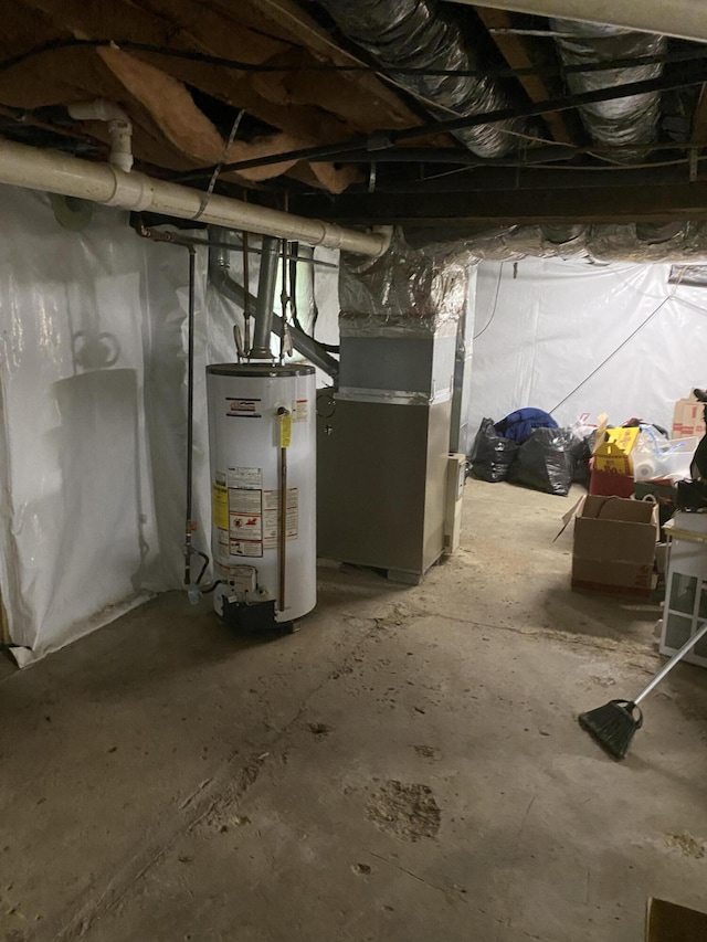 unfinished basement with water heater and heating unit