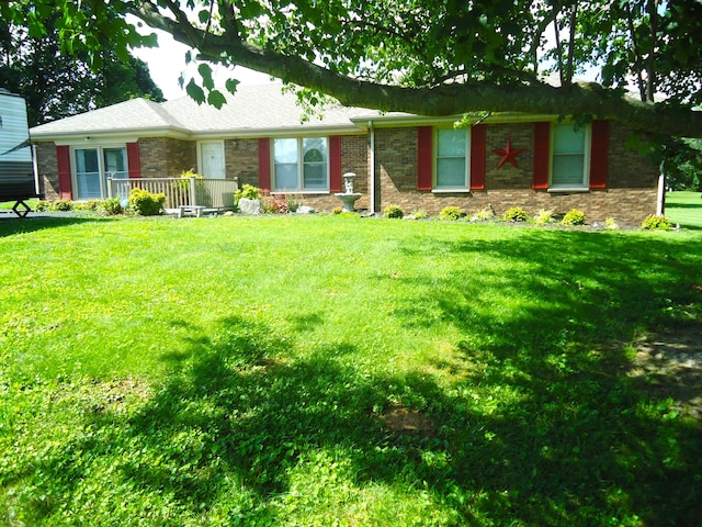 ranch-style home featuring a front yard