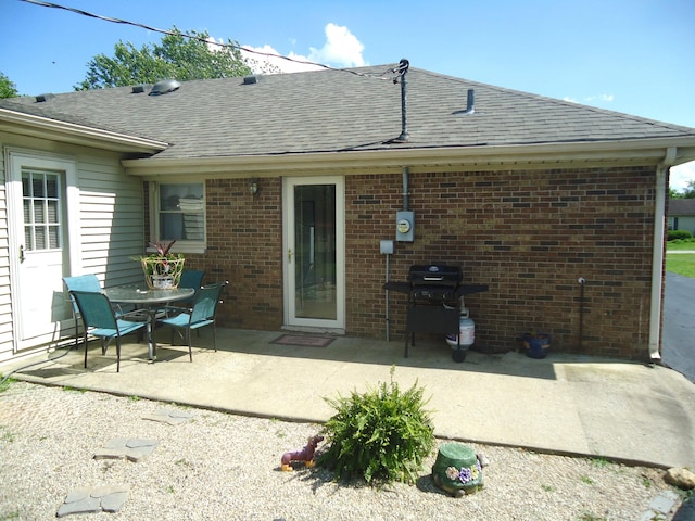 back of property with a patio area