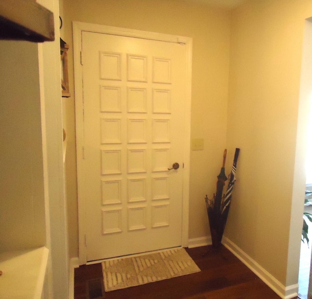 doorway featuring dark hardwood / wood-style floors