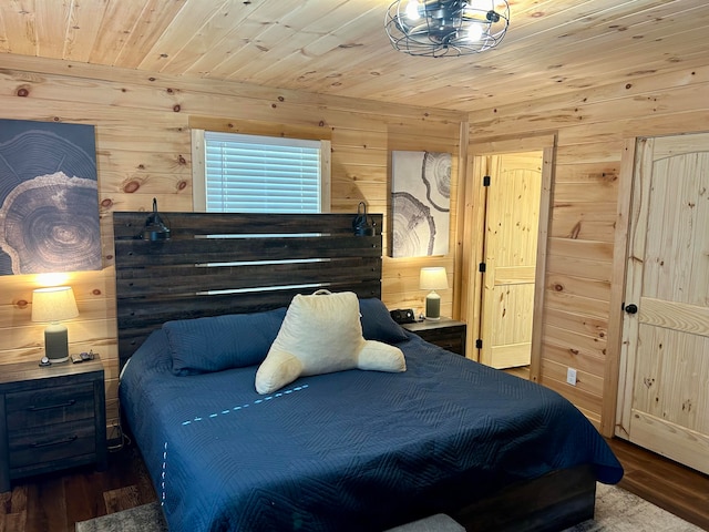 bedroom featuring wood ceiling, hardwood / wood-style flooring, and wooden walls