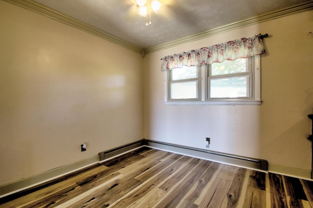 unfurnished room featuring wood-type flooring and ornamental molding