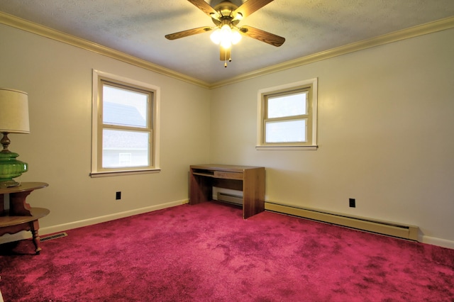 carpeted empty room featuring a baseboard heating unit, ceiling fan, and crown molding