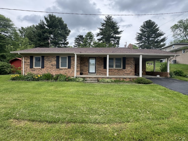 single story home featuring a front yard and a carport