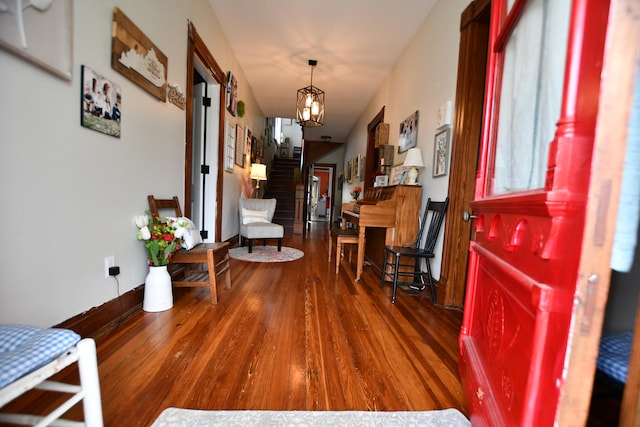 interior space with a notable chandelier and hardwood / wood-style flooring