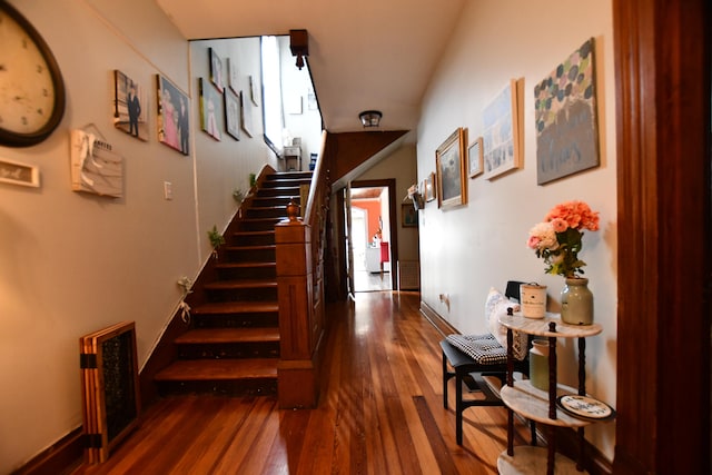 staircase featuring dark hardwood / wood-style floors