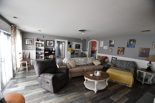 living room with plenty of natural light and wood-type flooring