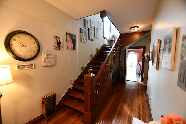 stairway featuring dark hardwood / wood-style floors