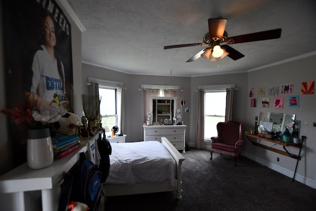 carpeted bedroom featuring a textured ceiling, ornamental molding, multiple windows, and ceiling fan