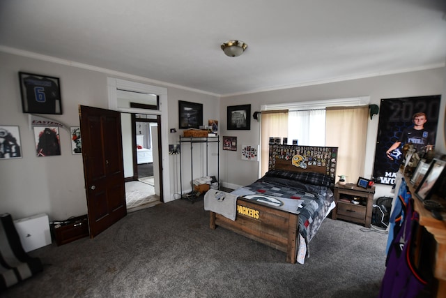 bedroom featuring crown molding and dark carpet