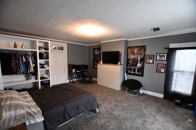 carpeted bedroom with a textured ceiling, a closet, and crown molding