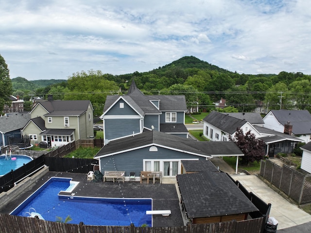 back of house with a patio area and a fenced in pool