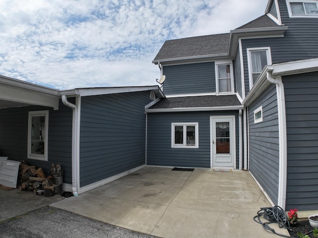 view of side of property with a patio