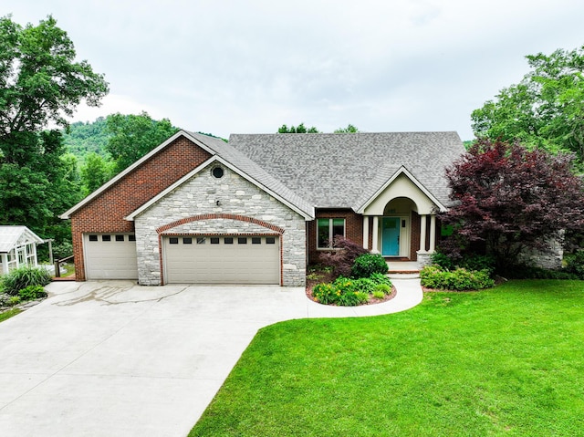 view of front facade with a garage and a front lawn