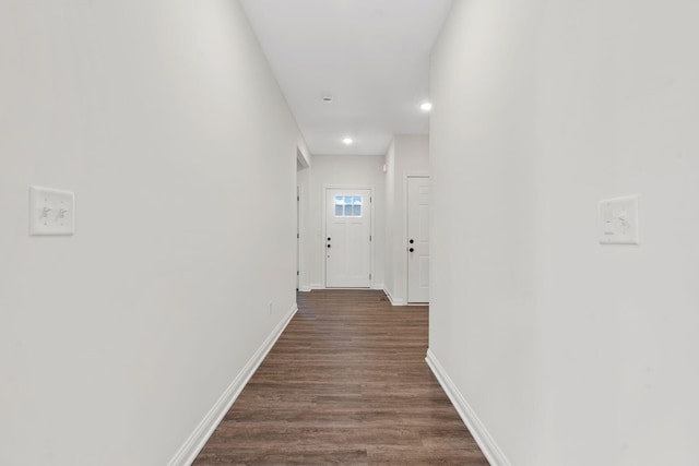 hallway featuring dark hardwood / wood-style flooring