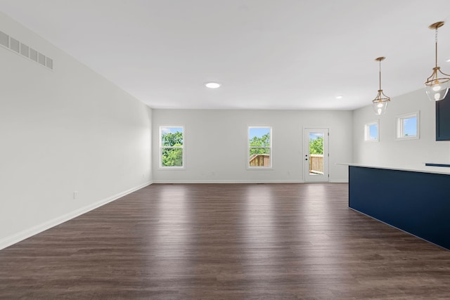 spare room with dark wood-type flooring