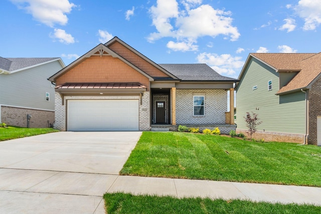 craftsman inspired home with a garage and a front lawn