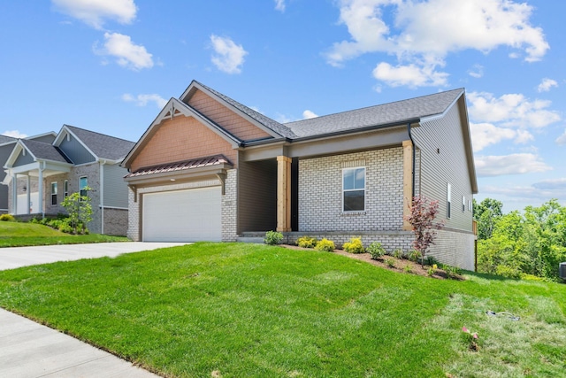 view of front of home with a garage and a front lawn