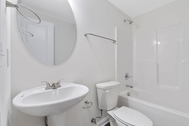 full bathroom featuring toilet, sink, and bathtub / shower combination