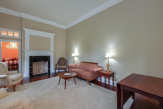 living room with a notable chandelier, ornamental molding, and dark wood-type flooring