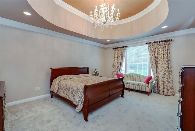 carpeted bedroom with crown molding, an inviting chandelier, and a raised ceiling