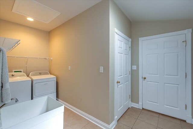 washroom featuring independent washer and dryer, sink, washer hookup, and light tile floors