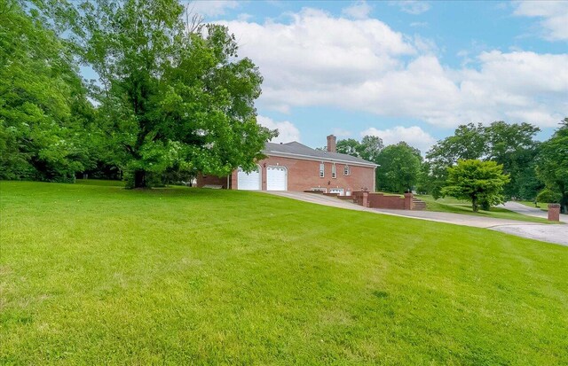 view of yard featuring a garage