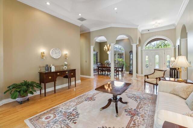 kitchen featuring light tile floors, a center island, ornamental molding, a breakfast bar, and appliances with stainless steel finishes