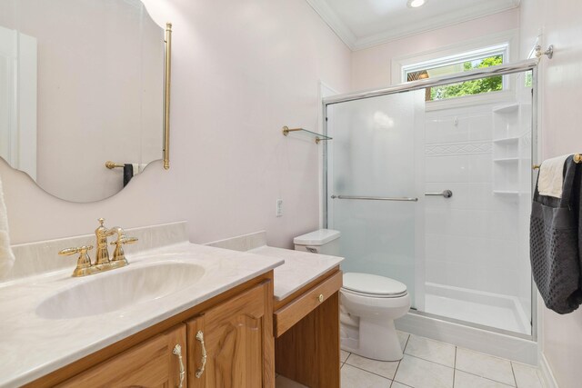 tiled bedroom featuring connected bathroom, ceiling fan, and crown molding