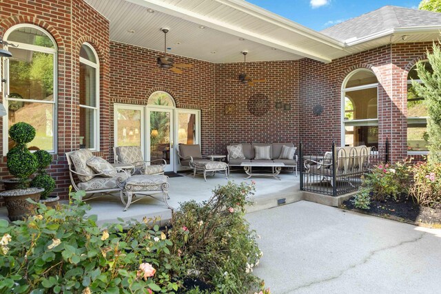 entryway with ornate columns, a high ceiling, a chandelier, and light hardwood / wood-style floors