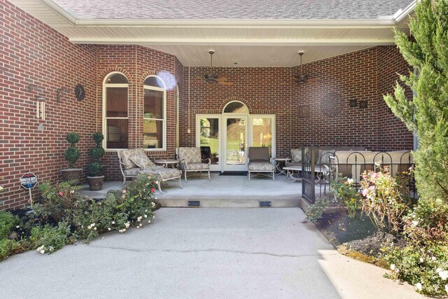 rear view of property with a yard and a patio area