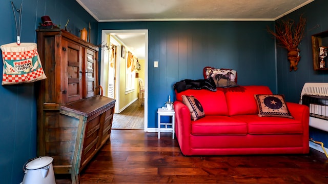 living room with crown molding and wood-type flooring