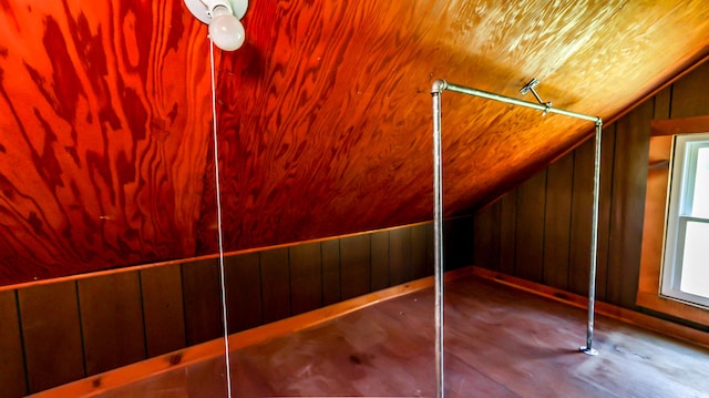 bonus room with wood walls, lofted ceiling, wooden ceiling, and hardwood / wood-style flooring